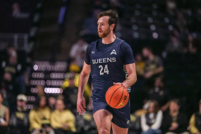 Queens University Royals guard Yoav Berman dribbles the ball against the Wake Forest Demon Deacons.