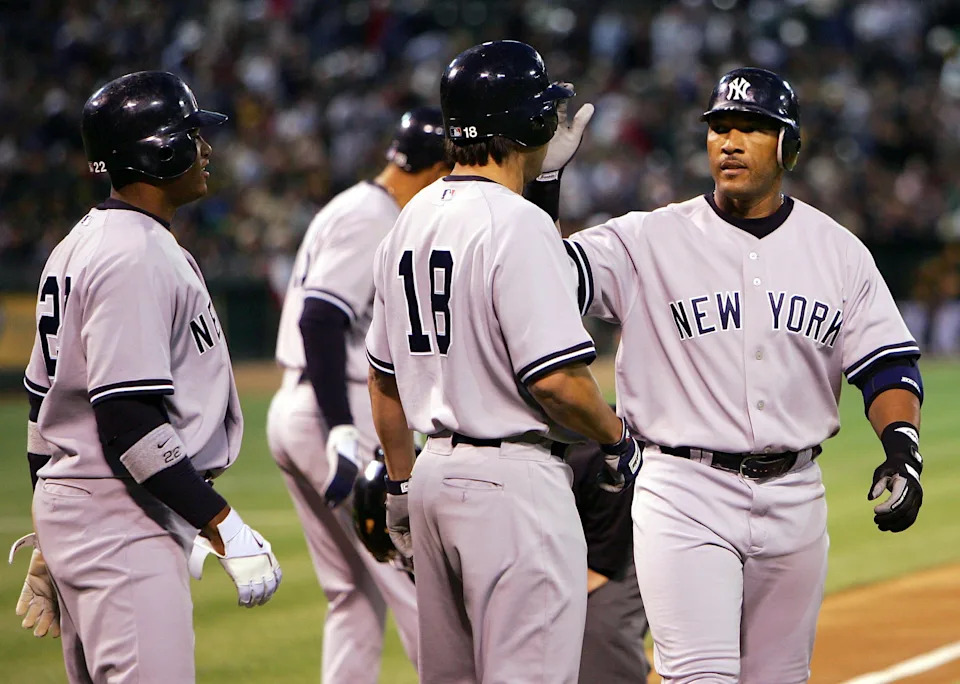 Gary Sheffield of the New York Yankees is congratulated by Johnny Damon after hitting a home run.