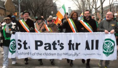 Marching behind the organization’s banner. Photos by Walter Karling