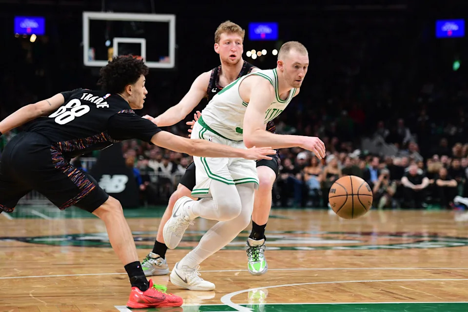 Feb 27, 2026; Boston, Massachusetts, USA; Brooklyn Nets guard Nolan Traore (88) tries to steal the ball from Boston Celtics forward Sam Hauser (30) during the second half at TD Garden. Mandatory Credit: Bob DeChiara-Imagn Images