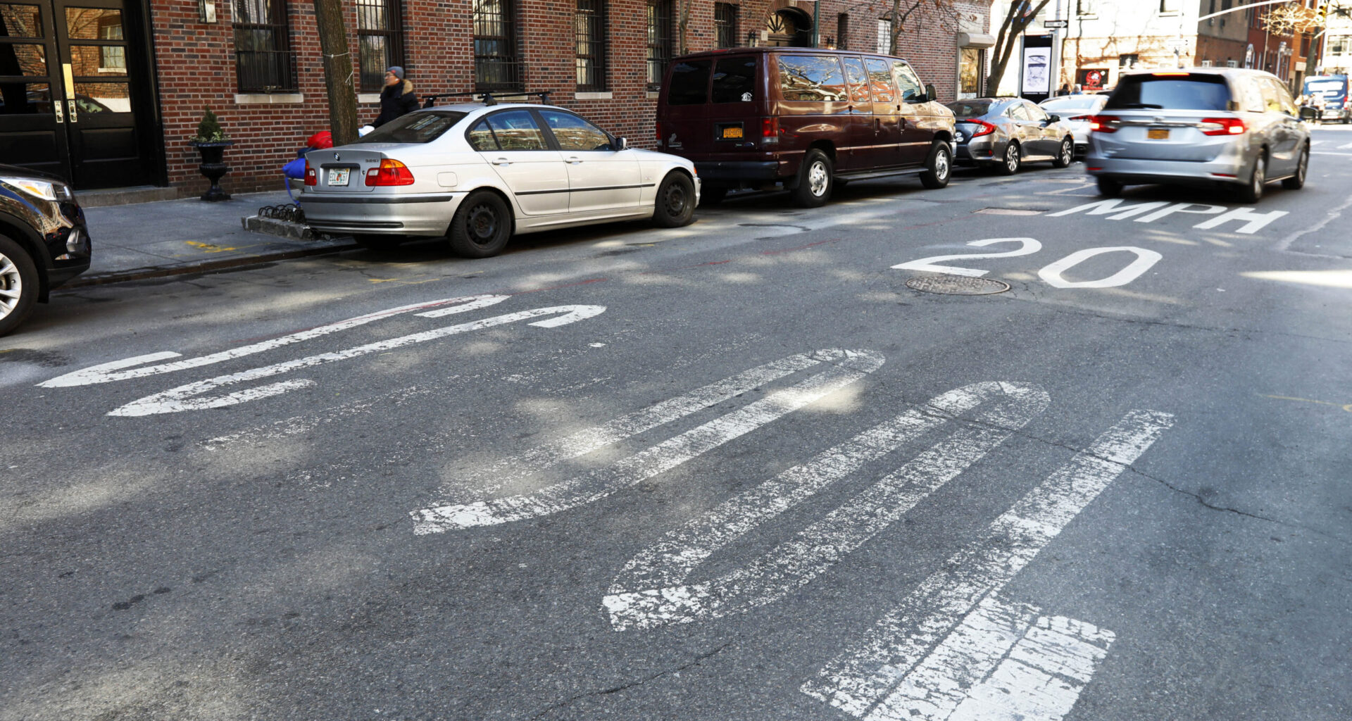 A car drives over a faded speed limit warning painted on Barrow Street, near City-As-School, a public high school, in the West Village, Tuesday, March 19, 2019. Photo: Richard Drew/AP