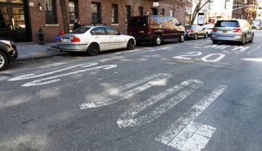 A car drives over a faded speed limit warning painted on Barrow Street, near City-As-School, a public high school, in the West Village, Tuesday, March 19, 2019. Photo: Richard Drew/AP