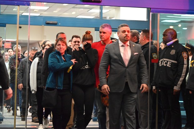 Members of the NYPD and the family of Officer Jonathan Diller are pictured during the dignified transfer of his body at Jamaica Hospital in Queens on Monday, March 25, 2024. NYPD Officer Jonathan Diller was fatally shot while conducting a vehicle stop on Mott Ave. in Far Rockaway. (Photo by Kyle Mazza / SOPA Images / Sipa USA via AP Images)