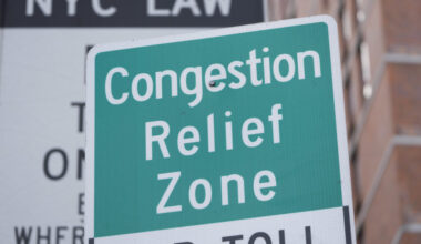 Signs, including some advising drivers of congestion pricing tolls, are displayed near the exit of the Lincoln Tunnel in New York, Wednesday, Feb. 19, 2025. AP Photo/Seth Wenig