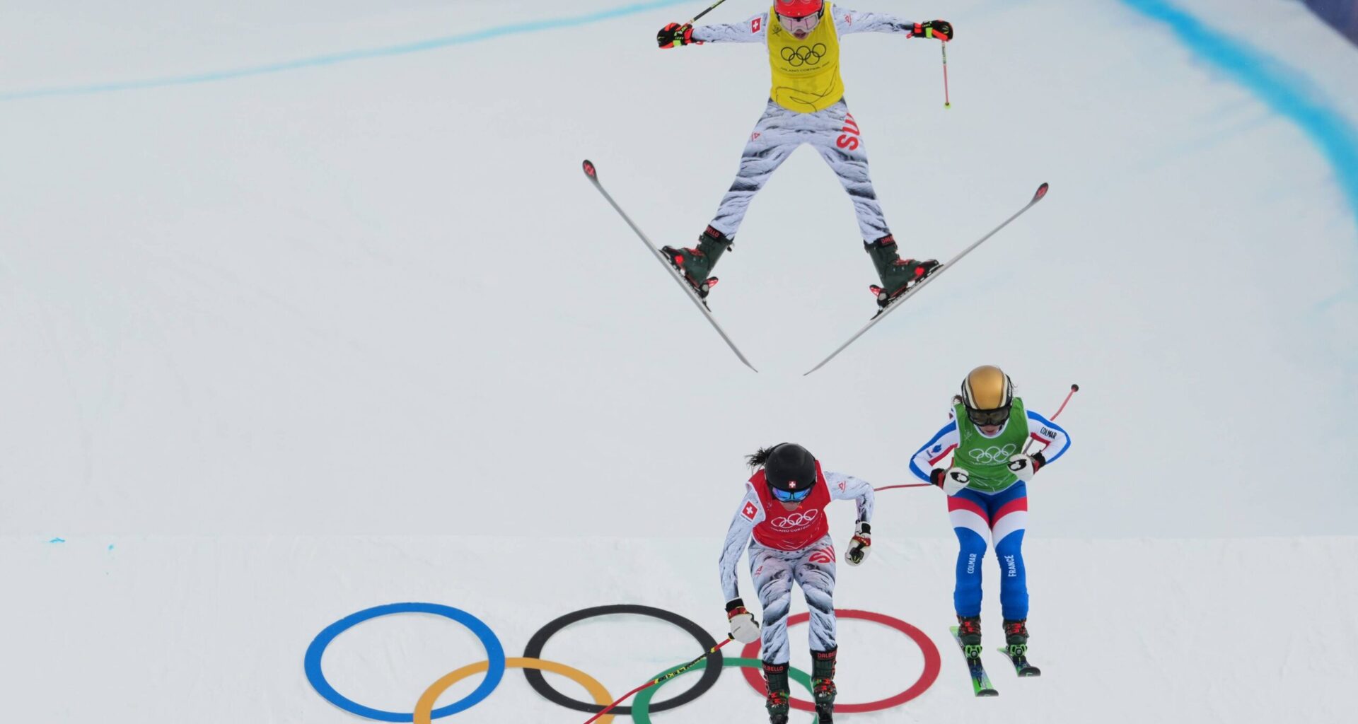 Clock wise from top, Switzerland's Sixtine Cousin (13), France's Jade Grillet Aubert (6) and Switzerland's Talina Gantenbein (5) compete during the women's ski cross finals at the 2026 Winter Olympics, in Livigno, Italy, Friday, Feb. 20, 2026. Photo: Julia Demaree Nikhinson/AP