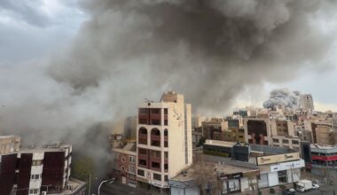 Plumes of smoke from two simultaneous strikes rise over Tehran, Iran