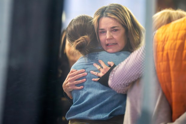 Savannah Guthrie hugs a staff member during a visit to the Today show at Rockefeller Plaza on Thursday, March 5, 2026, in New York. (Photo by Charles Sykes/Invision/AP)