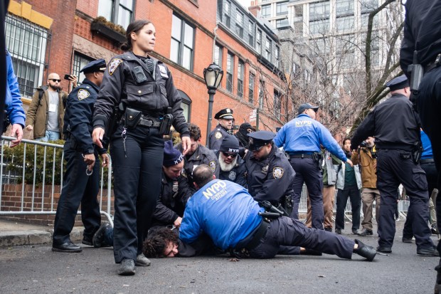 New York Police detain Emir Balat after he attempted to detonate an improvised explosive device outside Gracie Mansion in New York on Saturday. (AP Photo/Julius Constantine Motal)