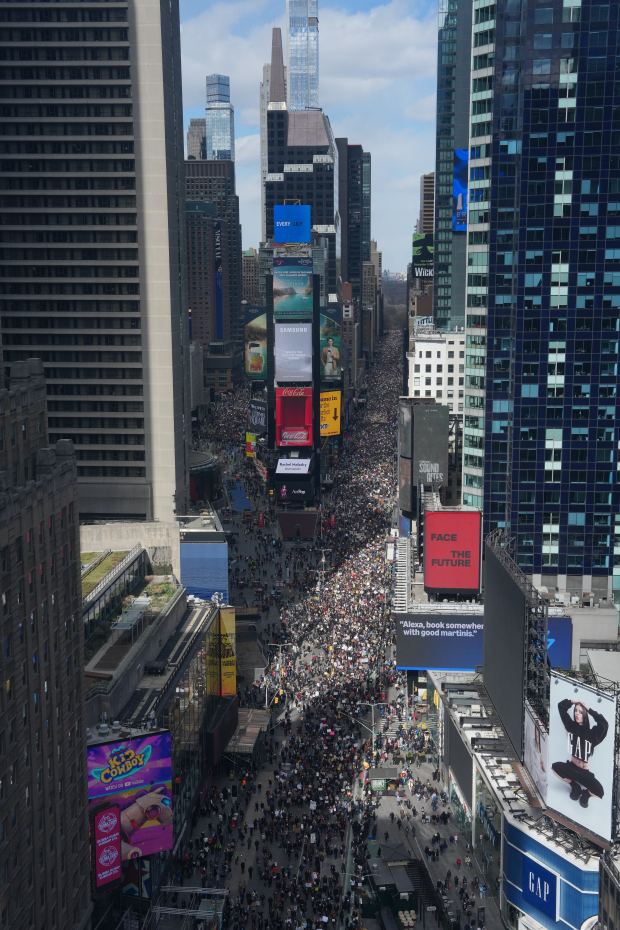 People attend a "No Kings" protest Saturday, March 28, 2026, in New York. (AP Photo/Adam Gray)