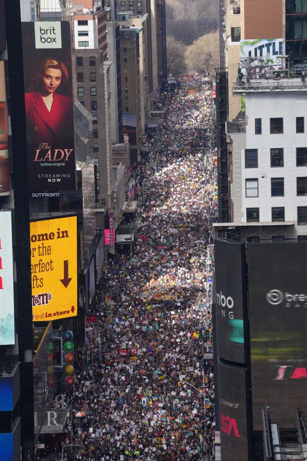 People attend a "No Kings" protest Saturday, March 28, 2026, in New York. (AP Photo/Adam Gray)