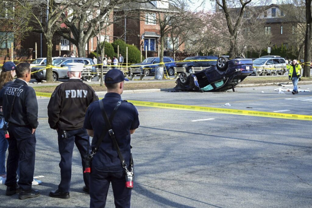This image provided by the Office of the New York Mayor shows the scene, Saturday, March 29, 2025, in the Brooklyn borough of New York, where a woman driving on a suspended license was speeding and failed to yield after stopping at a red light, collided with another vehicle and then into a family walking in the crosswalk. Photo: Mayoral Photography Office/Justin Persaud via AP