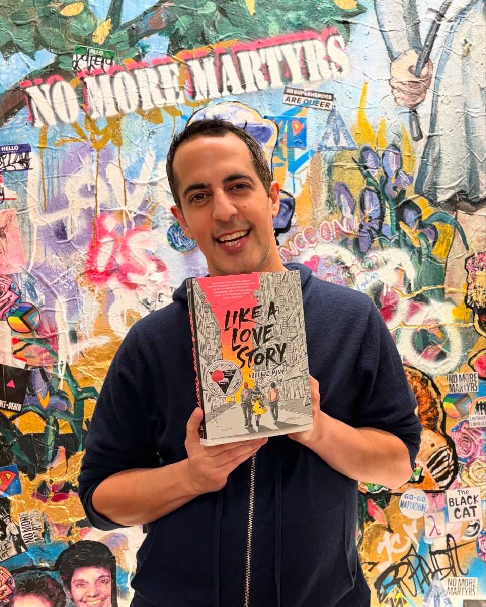 Abdi Nazemian and his novel, "Like A Love Story," which had made its way to the banned books list.