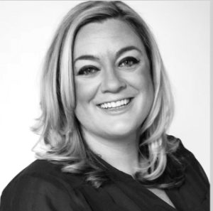 A black and white photo of a woman with blonde hair