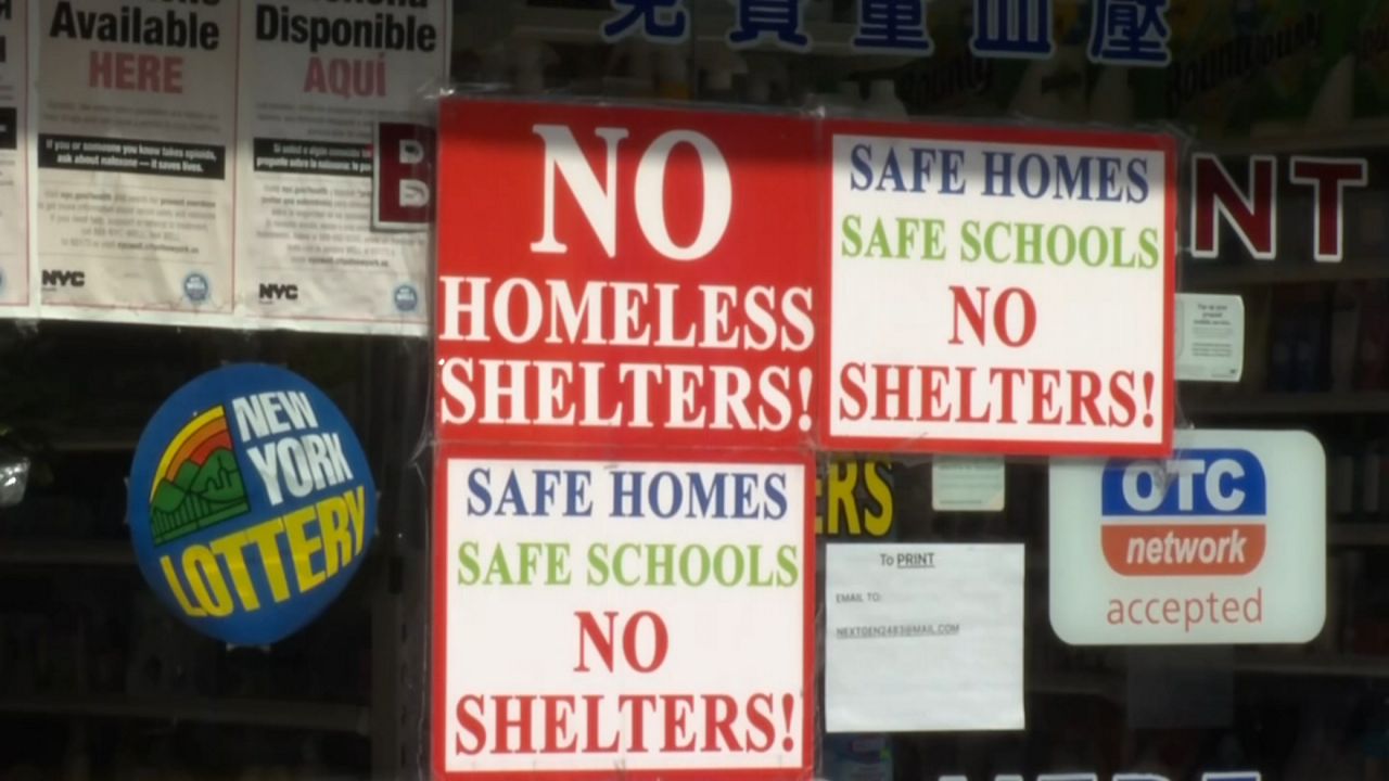 homeless shelter protest signs