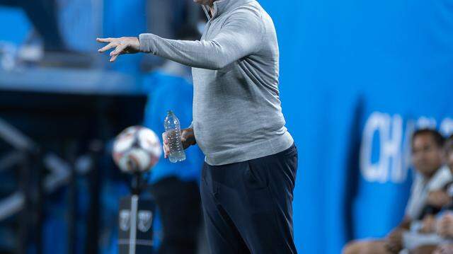 Charlotte FC head coach Dean Smith (center) calls out instructions to his players. Charlotte FC would win their home opener against Austin 3-1 Saturday March 7, 2026.