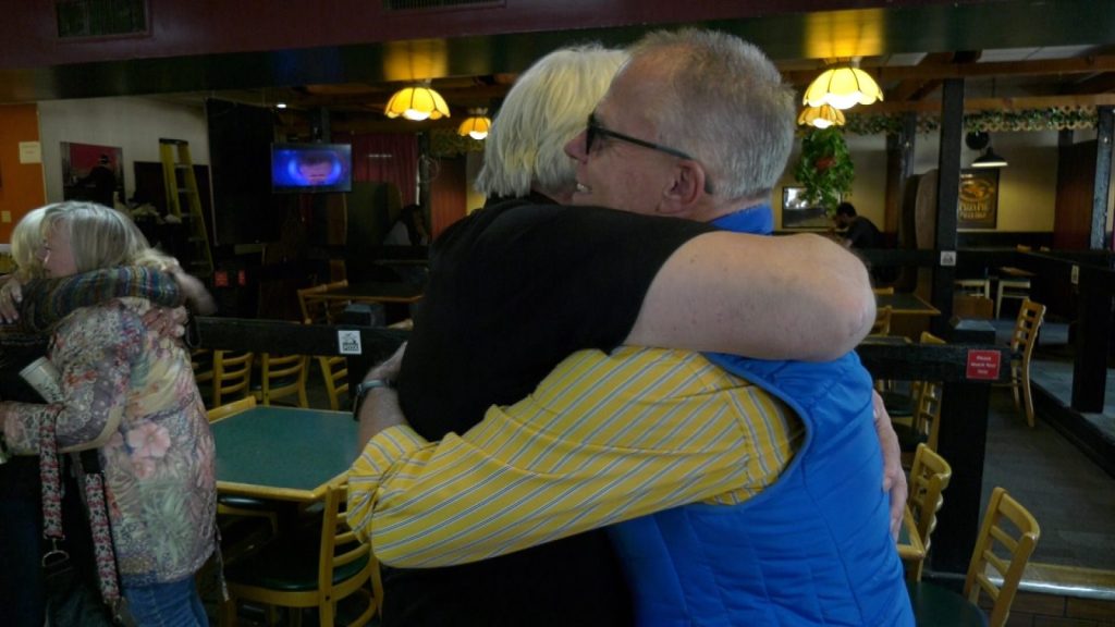 hugging in godfathers pizza