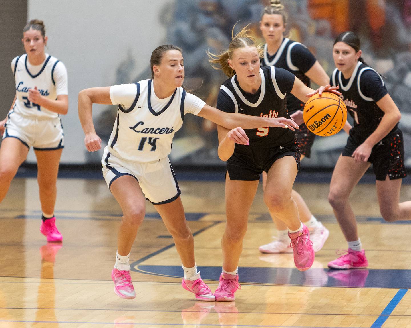 Lake Park's Maggie Frank battles for the ball with St. Charles East's Brooklyn Schilb on Wednesday, Jan.7,2026 in Roselle.