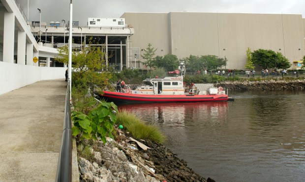 FILE - An FDNY boat is pictured in the Mill Basin Inlet next to the parking structure of Kings Plaza Mall in Brooklyn in 2018. (Theodore Parisienne for New York Daily News)