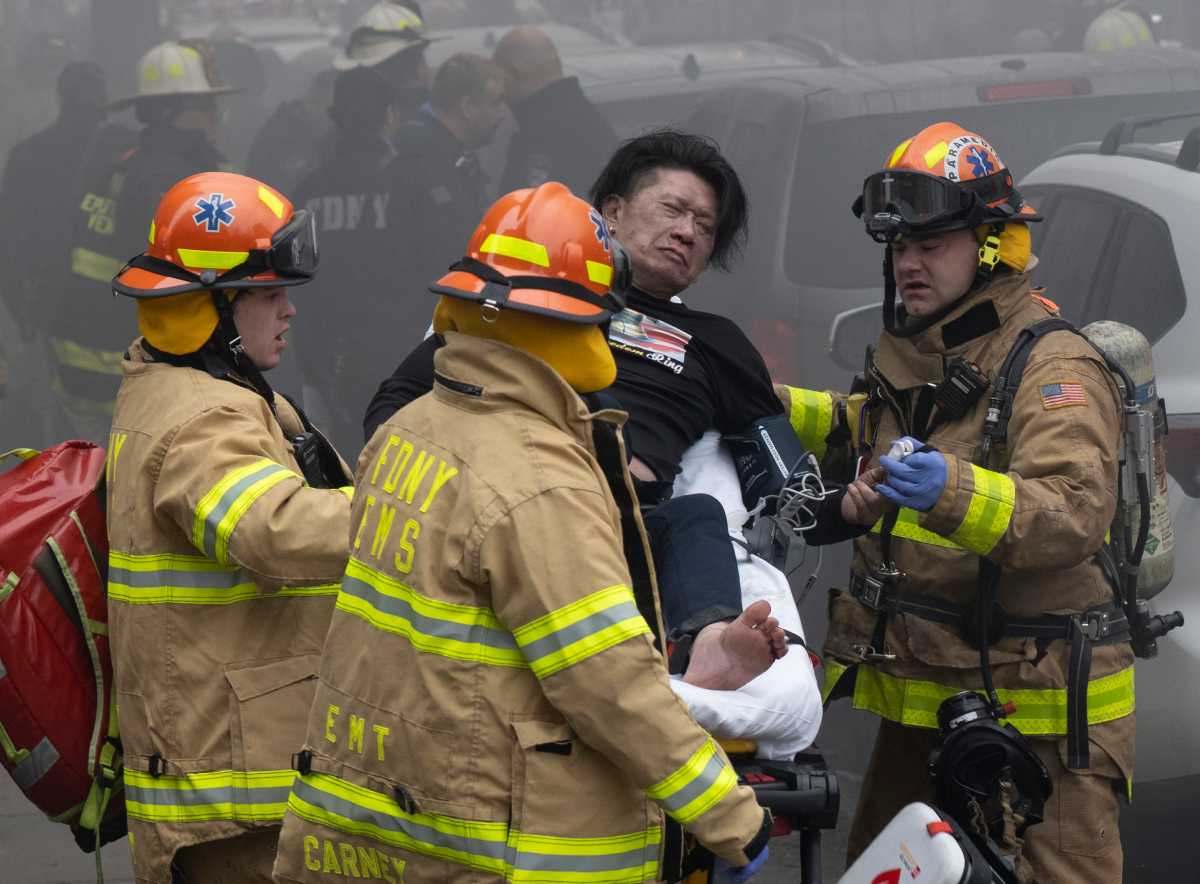 Authorities say three people are dead, including a child, after a four-alarm fire tore through a multi-family residence in Flushing on Monday, March 16.
