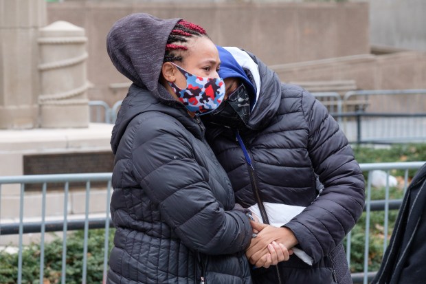 Loretta Surrency (left) and Michelle Surrency, aunt and mother of Monica Goods, embrace in Downtown Brooklyn on Jan. 4, 2021.