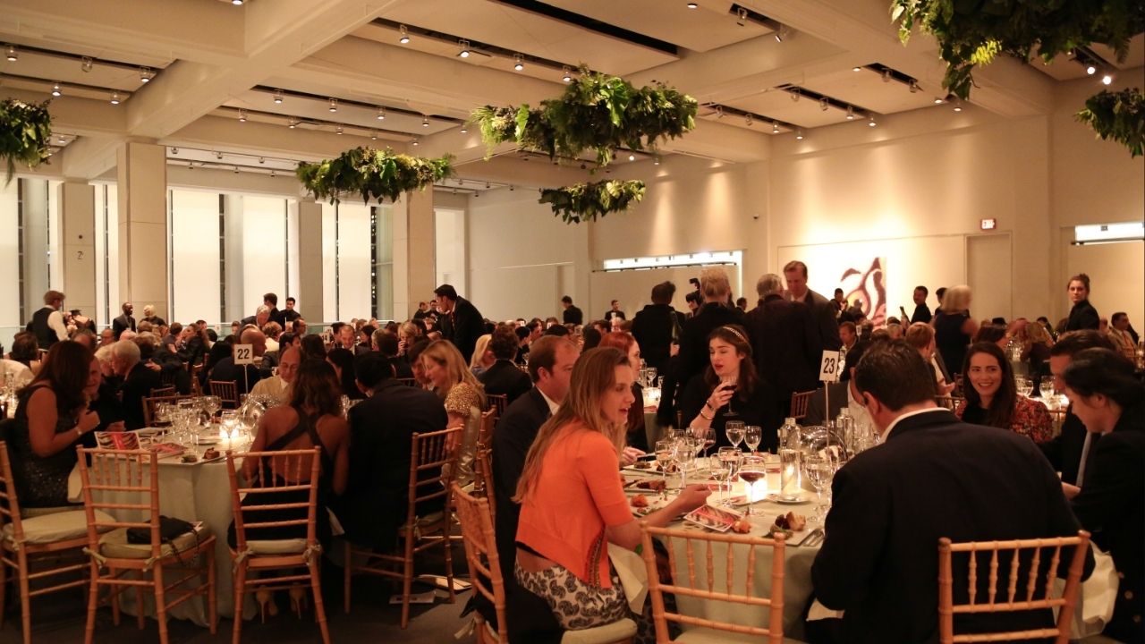 Attendees dine during The New York Academy of Art’s Take Home a Nude art auction in New York, Oct. 8, 2013. The New York Academy of Art, where a former student was among the first to complain to authorities about the behavior of Jeffrey Epstein, announced on Friday, March 13, 2026, that it was giving away money that Epstein had donated after new revelations about his involvement there were made public. (Erin Baiano/The New York Times)