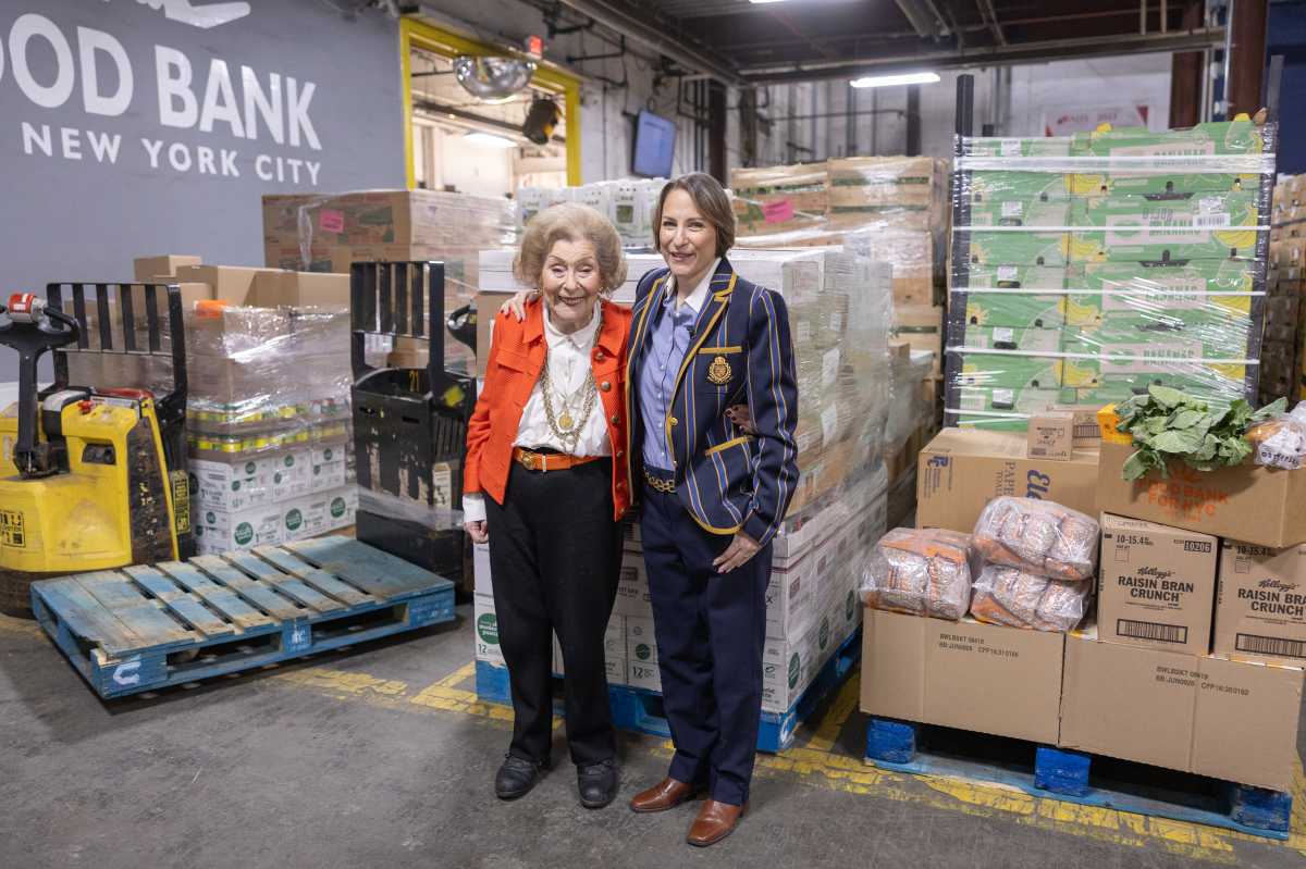 Leslie Gordan (right) with donations.