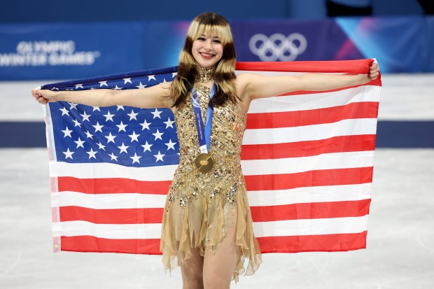 MILAN, ITALY - FEBRUARY 19: Gold medalist Alysa Liu of Team United States poses for a photo during the medal ceremony for the Women's Single Skating on day thirteen of the Milano Cortina 2026 Winter Olympic games at Milano Ice Skating Arena on February 19, 2026 in Milan, Italy. (Photo by Jamie Squire/Getty Images)