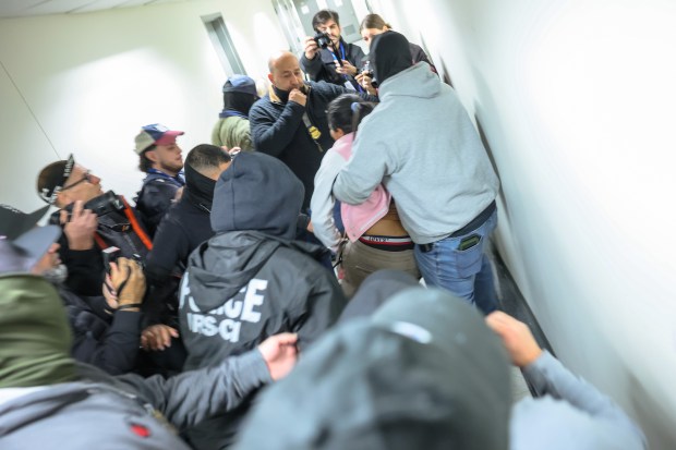 NEW YORK, NEW YORK - MARCH 04: Federal agents detain a woman leaving a court hearing in immigration court at the Jacob K. Javits Federal Building on March 04, 2026 in New York City. Immigration and Customs Enforcement (ICE) agents and other federal agencies continue to have a presence in immigration courts as immigrants attend court hearings, as the shutdown of the Department of Homeland Security, whose funding lapsed on February 14th. Some federal agents who patrol the 12th and 14th floors of the Federal Plaza building have begun wearing body cameras for the first time in their eight-month presence at the courthouse. (Photo by Michael M. Santiago/Getty Images)