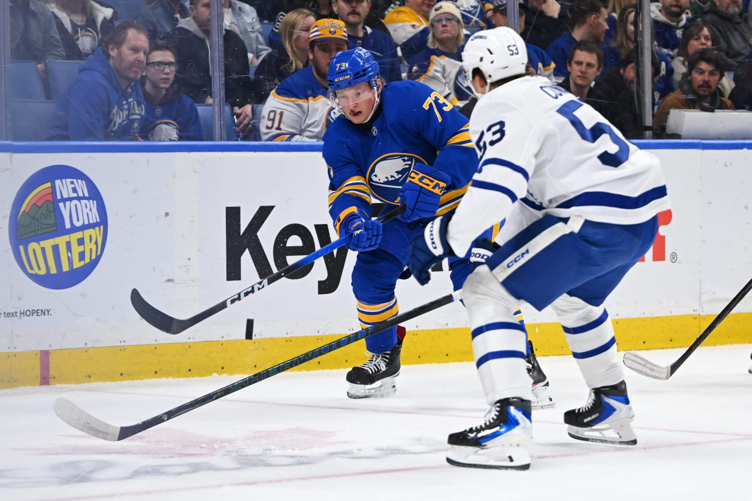Sabres defenseman Zach Metsa lifts a pass over a Leafs player's stick.