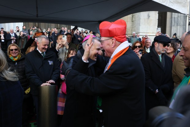 The Archbishop of New York Ronald Hicks greets Cardinal Timothy Dolan (R) during the annual St. Patrick's Day Parade in New York on March 17, 2026. (Photo by TIMOTHY A.CLARY / AFP via Getty Images)