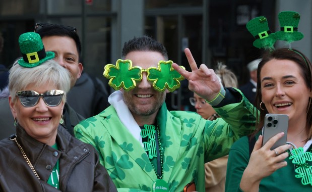 People watch the annual St. Patrick's Day Parade in New York on March 17, 2026. (Photo by TIMOTHY A. CLARY / AFP via Getty Images)