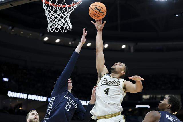 Trey Kaufman-Renn (4) of Purdue attempts a layup against Carson Schwieger of Queens University during the first half of the teams’ first-round NCAA Men’s Tournament game at Enterprise Center on March 20, 2026 in St Louis, Missouri.