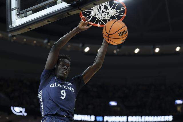 Maban Jabriel of Queens University dunks the ball during the second half against Purdue during the teams’ NCAA Men's Basketball Tournament first-round game at Enterprise Center on March 20, 2026 in St Louis, Missouri.