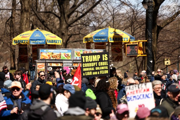 Protesters participate in the "No Kings" national day of protest in New York on March 28, 2026. Nationwide protests against US President Donald Trump are expected Saturday as millions of people vent fury over what they see as his authoritarian bent and other forms of cruel, law-trampling governance. It is the third time in less than a year that Americans will take to the streets as part of a grassroots movement called "No Kings," the most vocal and visual conduit for opposition to Trump since he began his second term in January 2025. (Photo by CHARLY TRIBALLEAU / AFP via Getty Images)