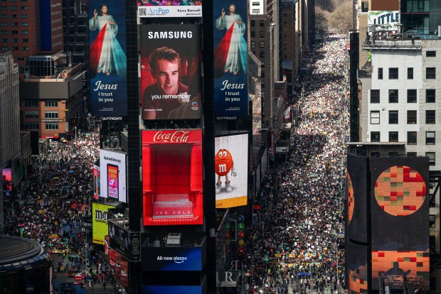 Protesters descend on Times Square during the "No Kings" national day of protest in New York on March 28, 2026. Nationwide protests against US President Donald Trump are expected Saturday as millions of people vent fury over what they see as his authoritarian bent and other forms of cruel, law-trampling governance. It is the third time in less than a year that Americans will take to the streets as part of a grassroots movement called "No Kings," the most vocal and visual conduit for opposition to Trump since he began his second term in January 2025. (Photo by CHARLY TRIBALLEAU / AFP via Getty Images)