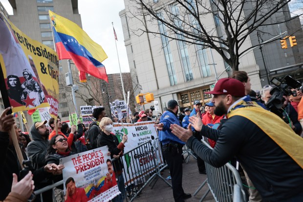 Supporters of former Venezuelan President Nicolas Maduro and counter protestors yell at each other outside of Manhattan Federal Court ahead of his court hearing on March 26, 2026. 