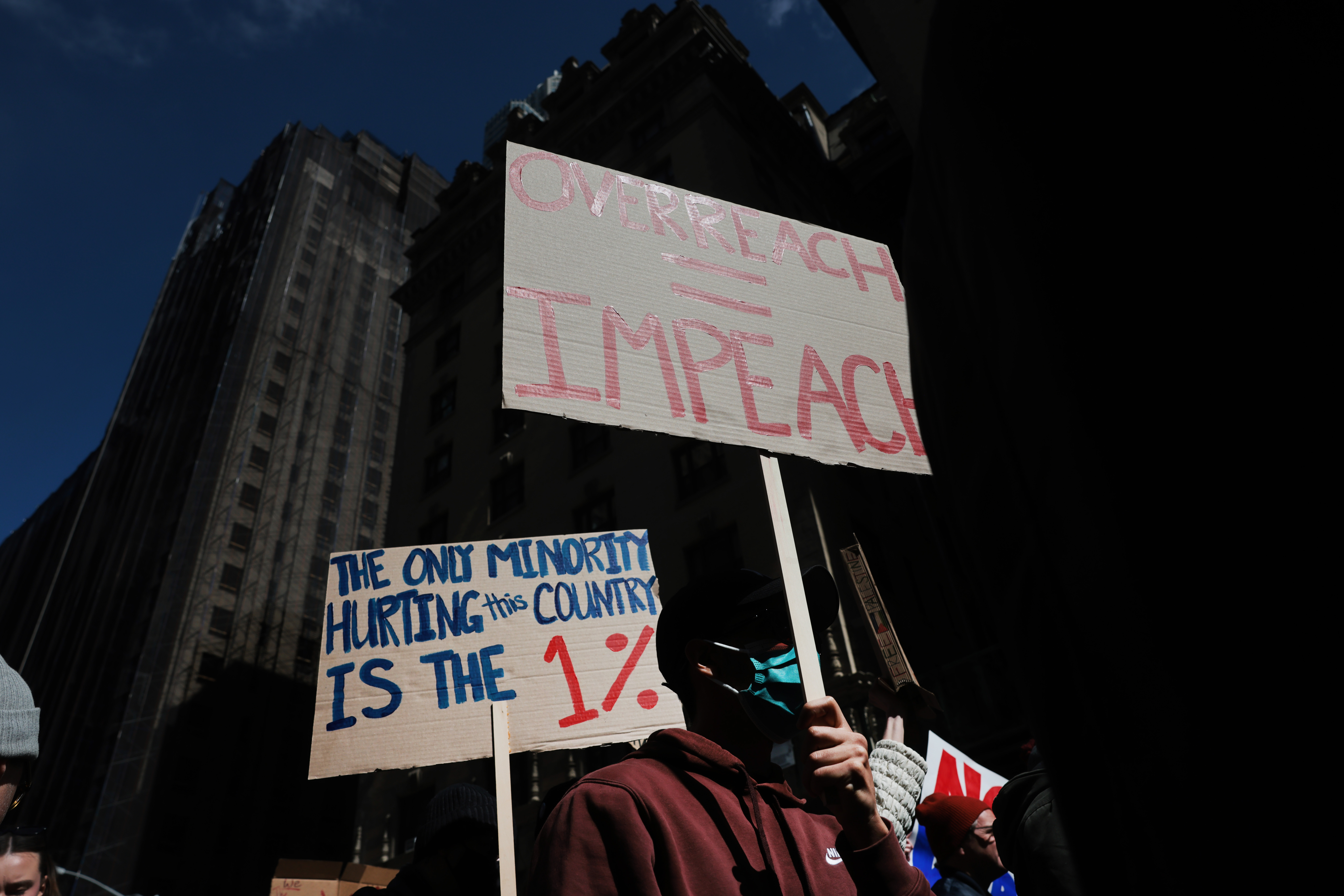 NEW YORK CITY - MARCH 28: Protesters hold signs as they participate in a 'No Kings' protest in Manhattan on March 28, 2026 in New York City. This is the third nationwide "No Kings" protest held against the Trump administration. (Photo by Spencer Platt/Getty Images)