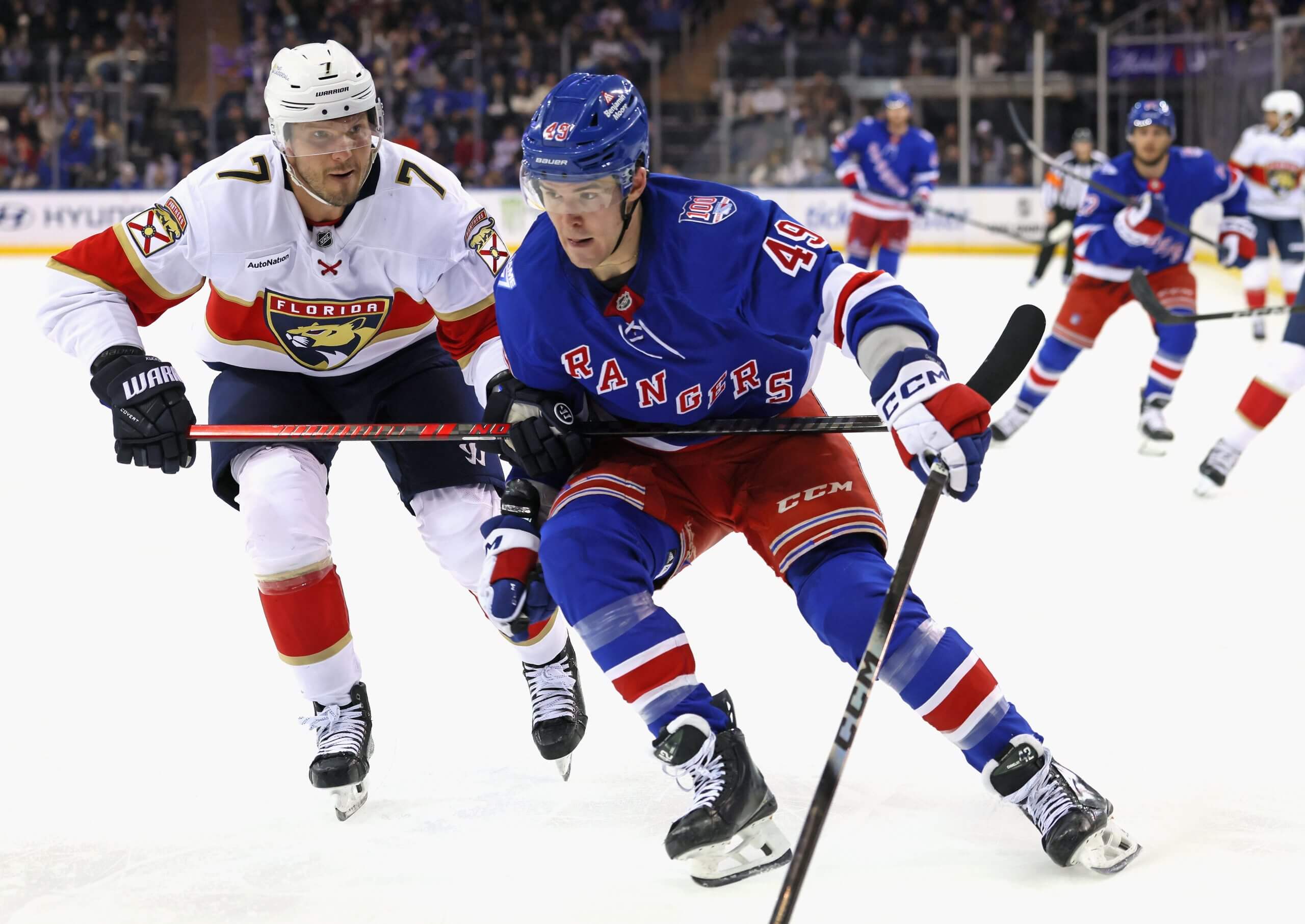 Florida's Dmitry Kulikov presses his stick across Jaroslav Chmelar's torso to slow him down.
