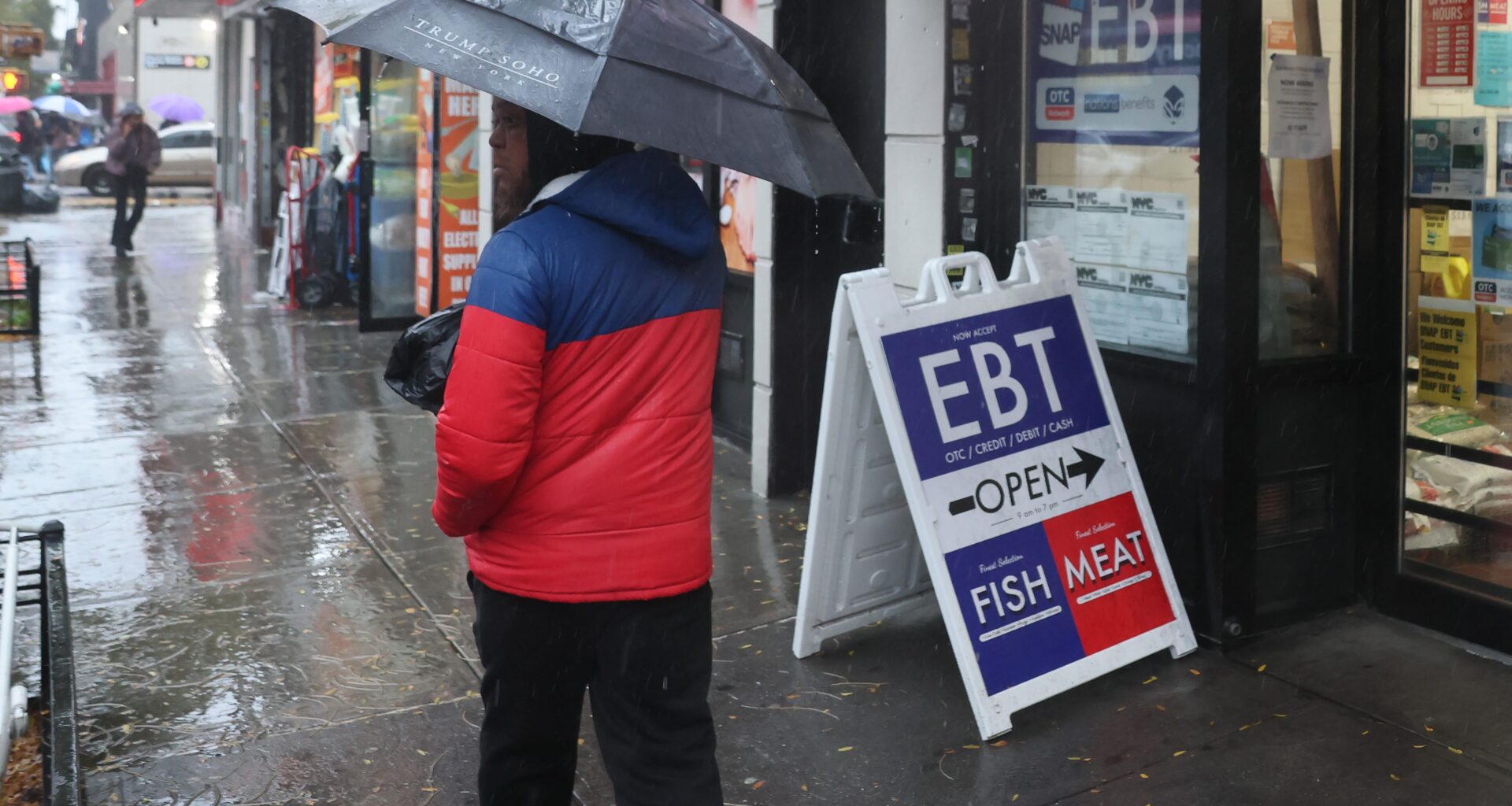 An EBT sign is displayed on the window of a grocery store in Flatbush last October