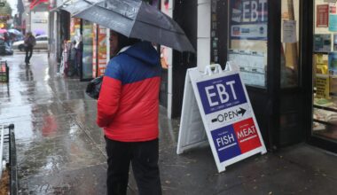 An EBT sign is displayed on the window of a grocery store in Flatbush last October