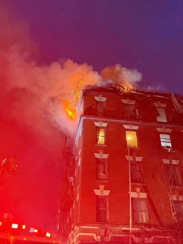 The fire broke out about 5:30 a.m. on a top-floor apartment of the E. 184th St. building near Bassford Ave. in Belmont, officials said. (FDNY via X.com)