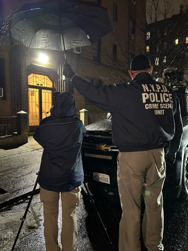 NYPD Crime Scene unit photographed on the scene where a man was slashed to death on 33rd St. in Astoria, Queens on March 3, 2026. 