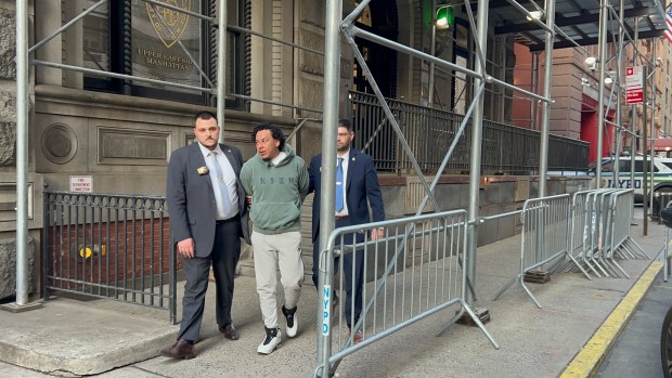 Suspect Bairon Hernandez, 34, who allegedly shoved two people onto the subway tracks over the weekend being walked by detectives from the Upper East Side on March 10, 2026. (Kerry Burke/New York Daily News)