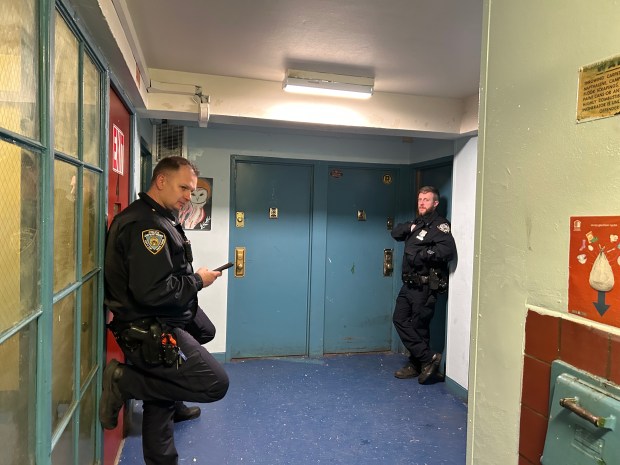 Police officers outside a fourth-floor apartment in Brooklyn's Sheepshead Bay Houses where a 16-year-old was left in critical condition after being shot in the chest. 3/23/26