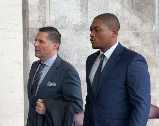 NYPD Officer Justin McMillan (right) is pictured with his attorney at Queens Criminal Court on Monday, March 31, 2025. (Sheetal Banchariya / New York Daily News)
