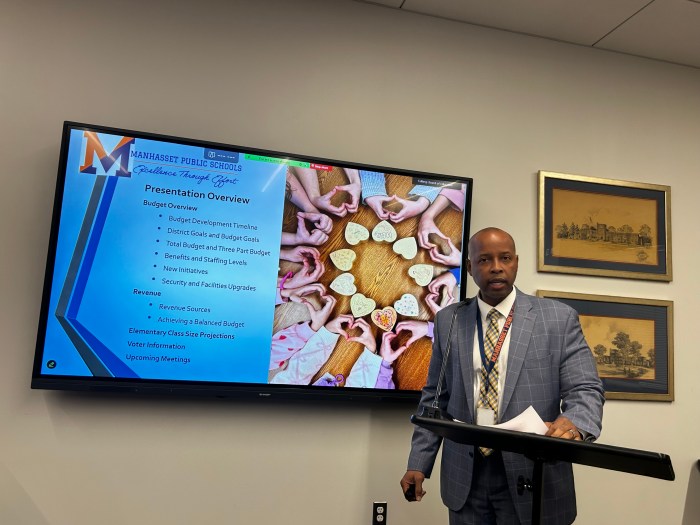 Assistant Superintendent for Business and Operations Gerard Antoine presenting on the district's proposed budget.