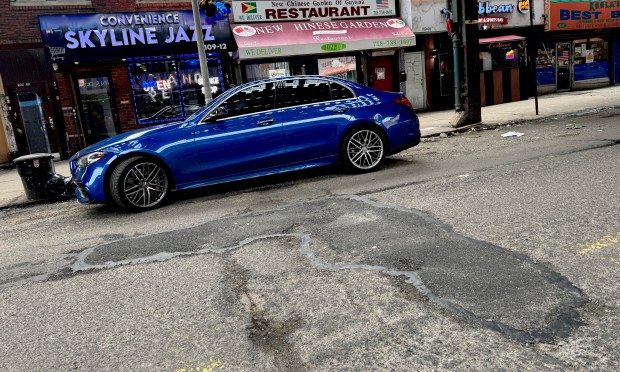 A large pothole was filled after a deadly accident at Liberty Ave between 109th Street and 110th Street on Monday. (Rebecca White / New York Daily News)