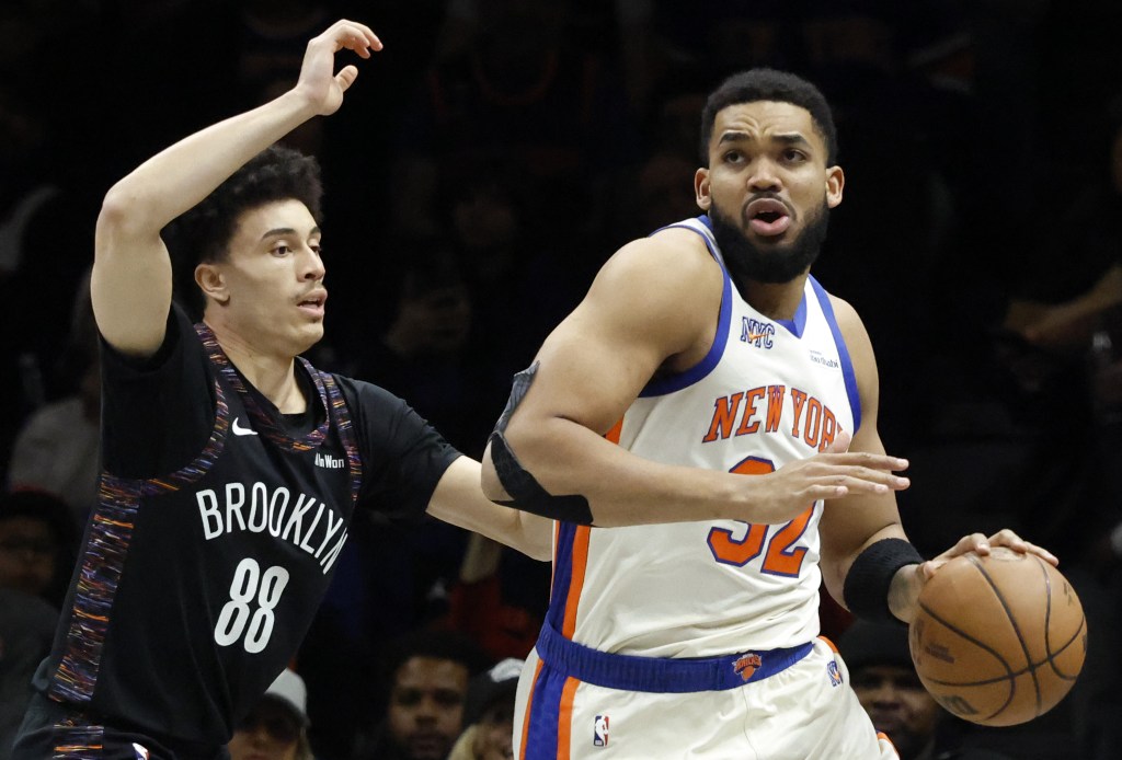 Karl-Anthony Towns, who scored 26 points and grabbed 15 rebounds, drives past Nolan Traore during the Nets' loss to the Knicks at Barclays Center.