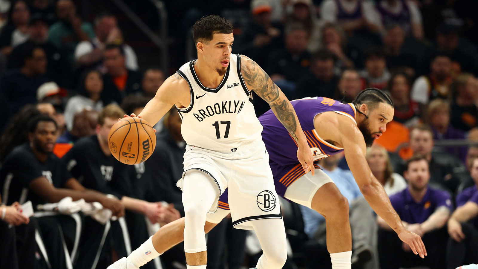 Brooklyn Nets forward Michael Porter Jr. (17) against Phoenix Suns forward Dillon Brooks (3) in the first half at Mortgage Matchup Center.