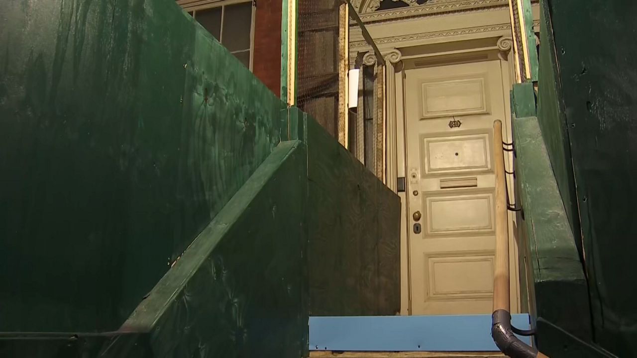 Supporters gathered inside the Merchant's House Museum Monday, urging the city's Landmarks Preservation Commission to reject a proposal to demolish a neighboring garage and build a new commercial building. (Spectrum News NY1)
